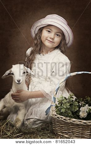 Portrait Of A Little Girl With A Baby Goat