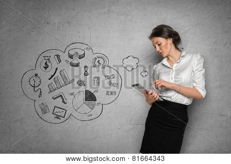 Woman on concrete wall with business sketches