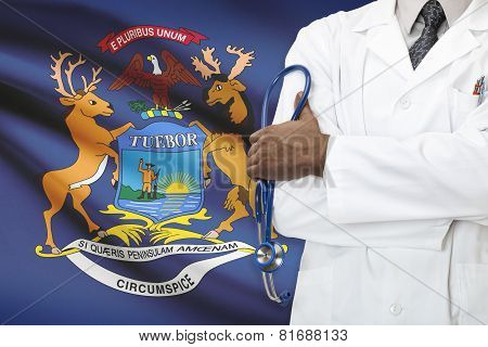 Concept Of National Healthcare System - Michigan flag on background