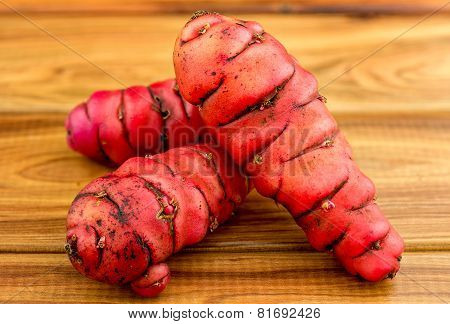Fresh Red New Zealand Yams (pink Oca) On Wood