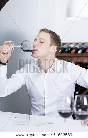 Winemaker Tasting A Red Wineglass.
