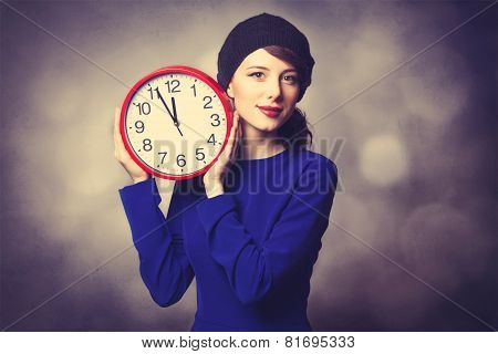 Women In Blue Dress With Huge Clock