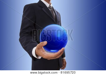 Businessman hand holding blue crystal Ball.