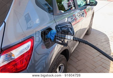 Passenger Car Fueled With Petrol At A Petrol Station