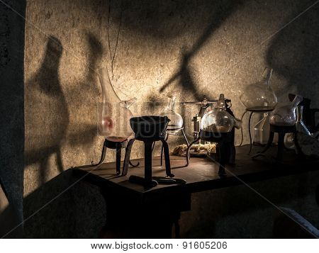 Ancient alchemist's lab with instruments and equipment