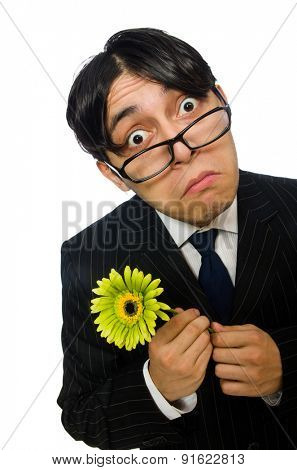 Young man in black costume with flower isolated on white