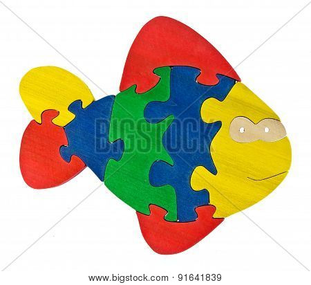 Colorful wooden puzzle in fish shape on isolated background