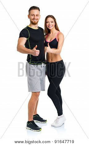 Athletic Man And Woman After Fitness Exercise With Thumbs Up On The White