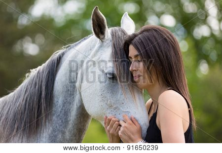 Young Woman With Her Horse