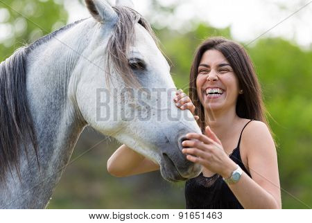 Young Woman With Her Horse