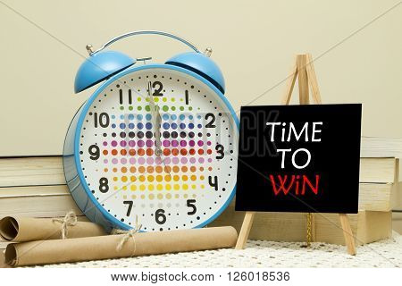 Time to win. Business Concept. text written on small Blackboard on easel