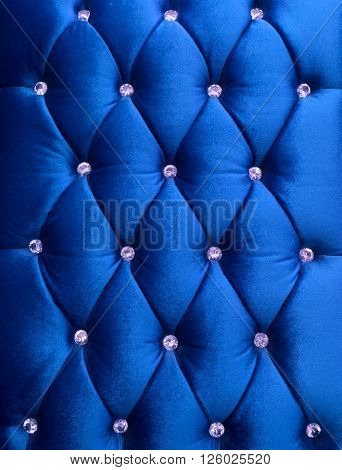 Blue upholstery velveteen decorated with crystals as texture and pattern