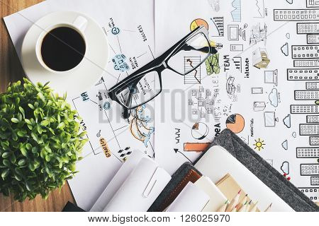Topview of desk with coffee glasses and plant on business concept sketch