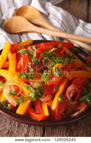 Stewed Peppers With Tomatoes And Onions Close Up On A Plate. Vertical
