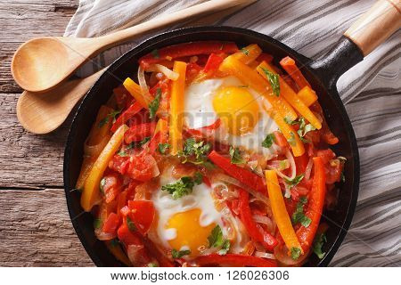 Basque Breakfast: Fried Eggs With Peppers Close-up. Horizontal Top View