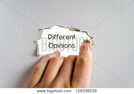 Different opinions note in business man hand