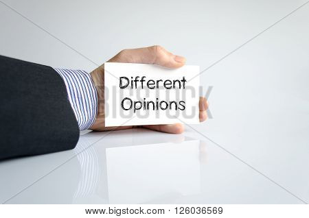 Different opinions note in business man hand