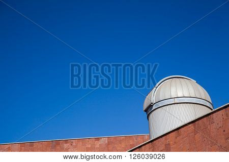 An incredible blue sky over a closed telescope