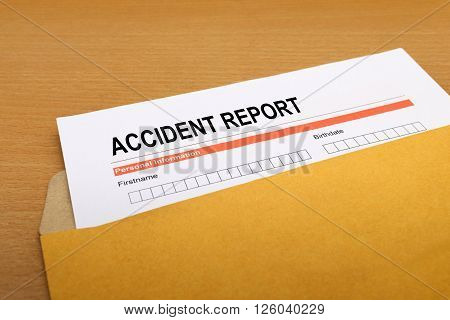 Accident report form on brown envelope, paper