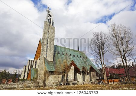 ZAKOPANE POLAND - MARCH 09 2016: Holy Cross Parish Church was built between 1983-1991 by the project of architect Professor Witold Ceckiewicz