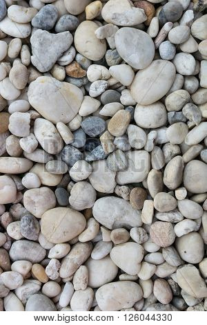 Pebble stones on coastline, surface, texture ,