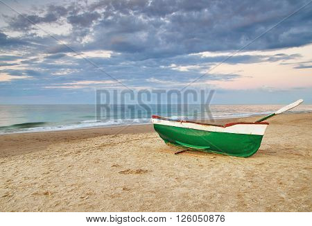 Old fishing boat on beach of the Baltic Sea