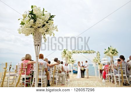 soft focus of beautiful flower decoration in the beach wedding ceremony