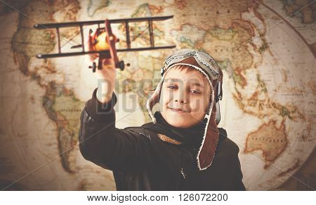 child boy teenager dreams of becoming a pilot and an aviator traveling