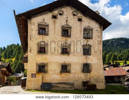 Colle Santa Lucia, Italy - September 6, 2012: Old house Casa 'Chizzali-Bonfadini' in the small town of Colle Santa Lucia along the Great Dolomite Road in Italian Alps