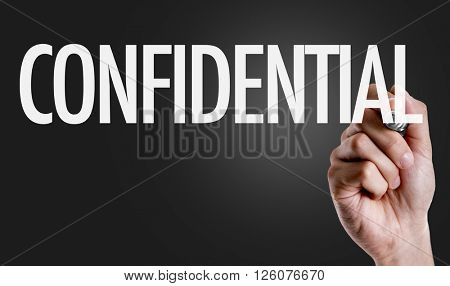 Hand writing the text: Confidential 