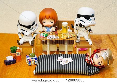 BANGKOK, THAILAND - April 11, 2016 : Stormtroopers and Ironman figure model setup in Late night party, The stormtroopers and Ironman are the famous character in the movies