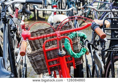 red bicycle at a bicycle parking lot in a Dutch city