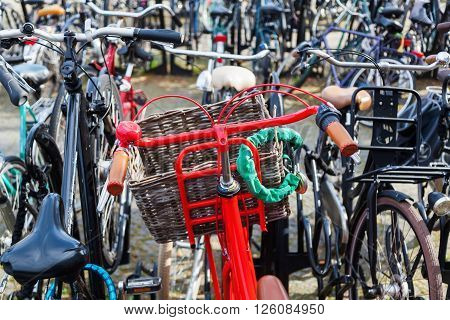 red bicycle at a bicycle parking lot in a Dutch city