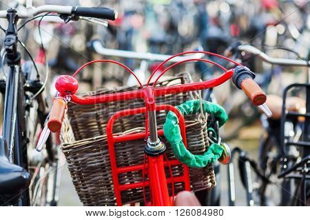 red bicycle at a bicycle parking lot in a Dutch city