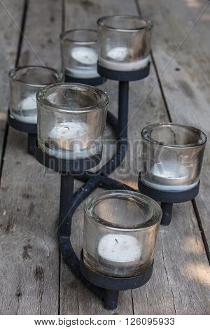 Candlesticks set are staying on a table
