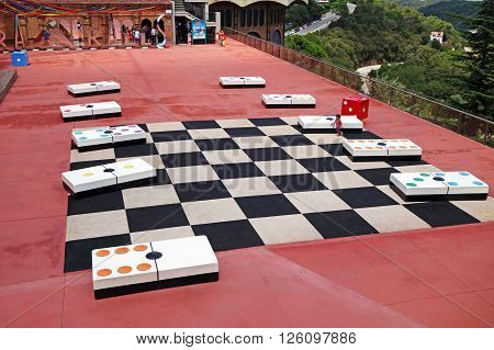 BARCELONA, SPAIN - AUGUST 1, 2015: View of Tibidabo Amusement Park built by the entrepreneur Salvador Andreu and opened in 1899. The park is one of the oldest in the world that is still functioning.