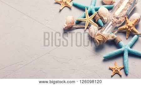 Marine items on grey tetured slate background. Sea objects. Selective focus. Place for text. Toned image.