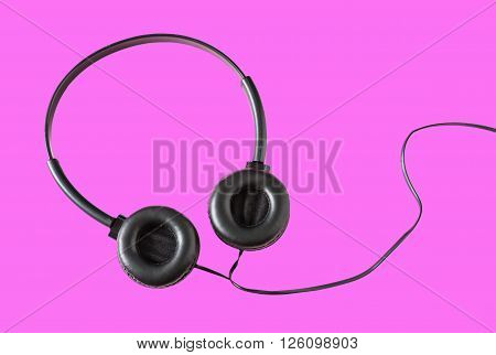 Headphones on pink color background Still life tone