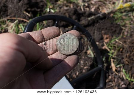 Search for coins with metal detectors a suuny day.