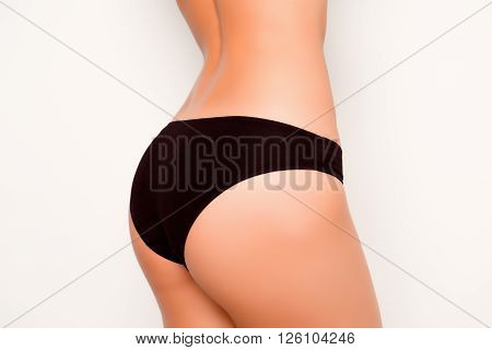 Close Up Photo Of Girl's  Fit Shapely Buttocks With Black Panties