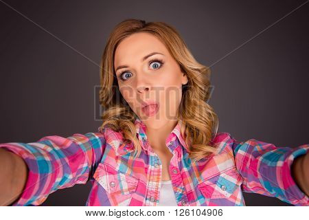 Creative Woman Making Funny Selfie And Showing Tongue