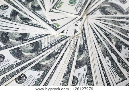 Close-up of a lot of one hundred dollar bills. Much money. A lot of money. Counterfeit money. Selective focus.