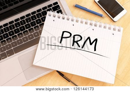 PRM - Partner Relationship Management - handwritten text in a notebook on a desk - 3d render illustration.