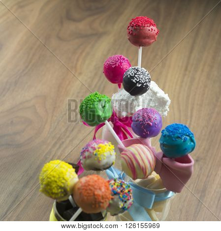 Cake pops sweet soft food made from a mixture of flour shortening eggs sugar and other ingredients baked and often decorated