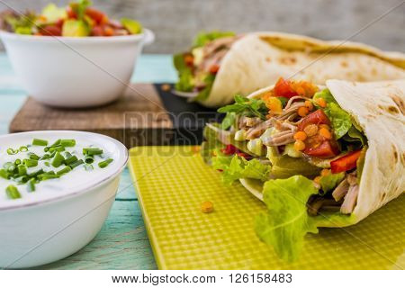 Tortilla with pulled pork, fresh vegetables
