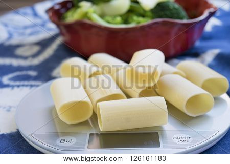 handmade paccheri of gragnano on a kitchen scale