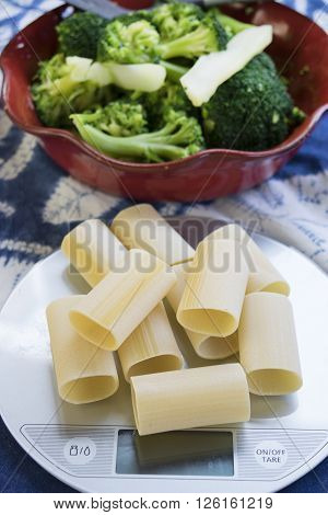 handmade paccheri of gragnano on a kitchen scale
