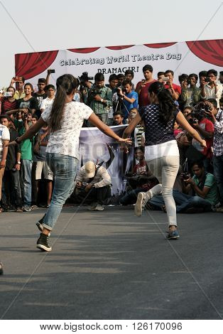 HYDERABAD,INDIA-MARCH 27:Indian young people dancing on open road event on Sunday morning, celebrating World theater day on March 27,2016 in Hyderabad,India.