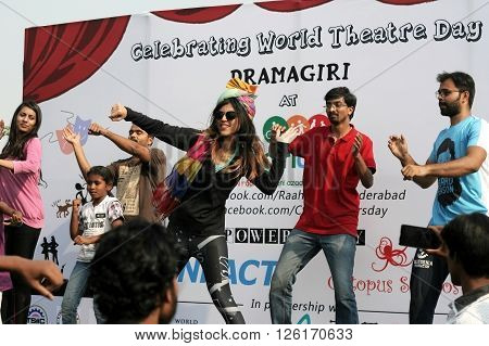 HYDERABAD,INDIA-MARCH 27:Indian young people dancing on open road event on Sunday morning, celebrating World theater day on March 27,2016 in Hyderabad,India.