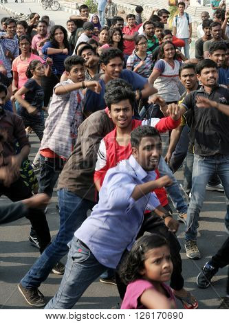 HYDERABAD,INDIA-MARCH 27:Indian young people dancing on open road event on Sunday morning, celebrating World theater day on March 27,2016 in Hyderabad,India.